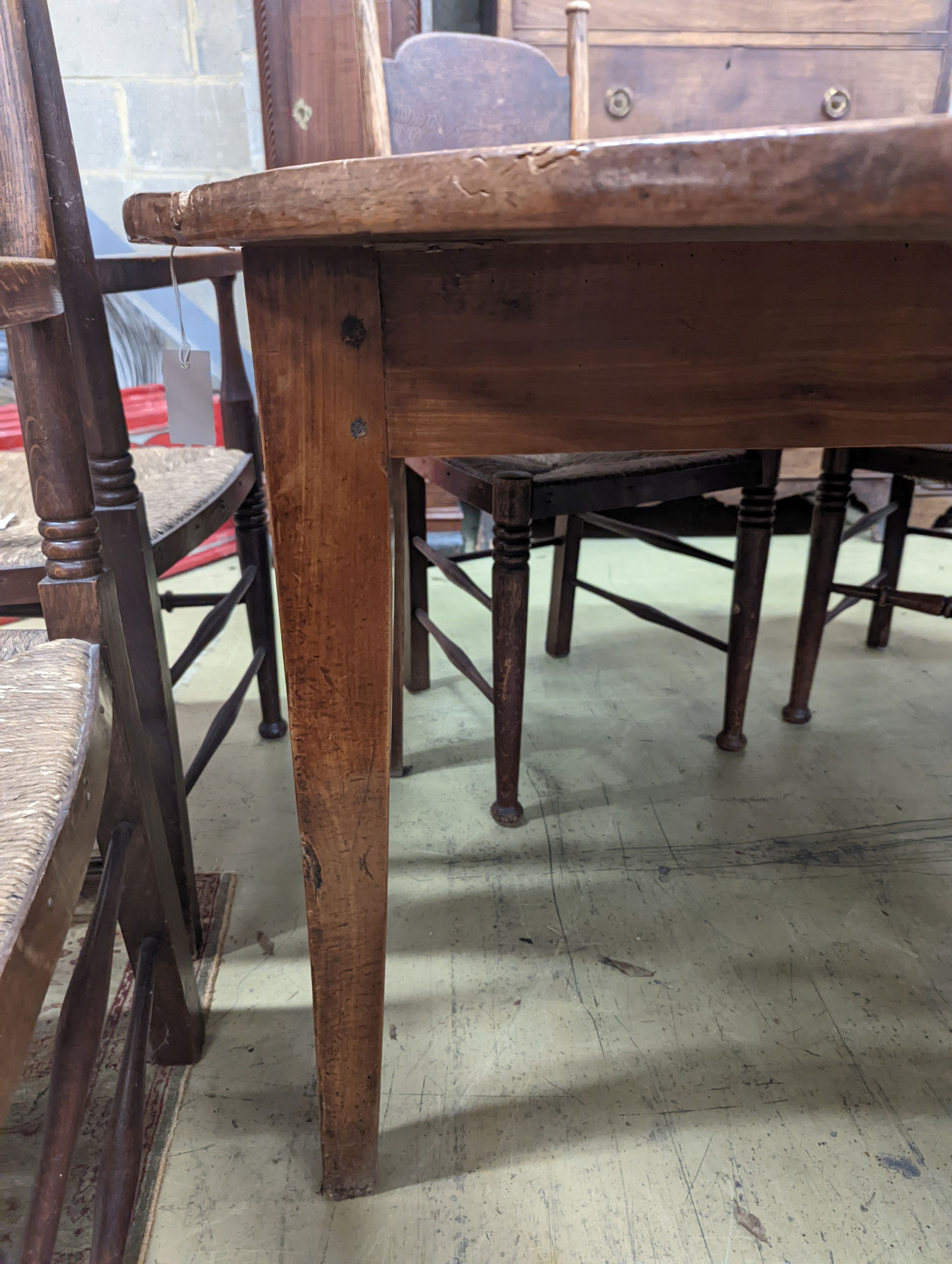 A 19th century French fruitwood circular dropleaf dining table, length 145cm extended, width 144cm, height 73cm